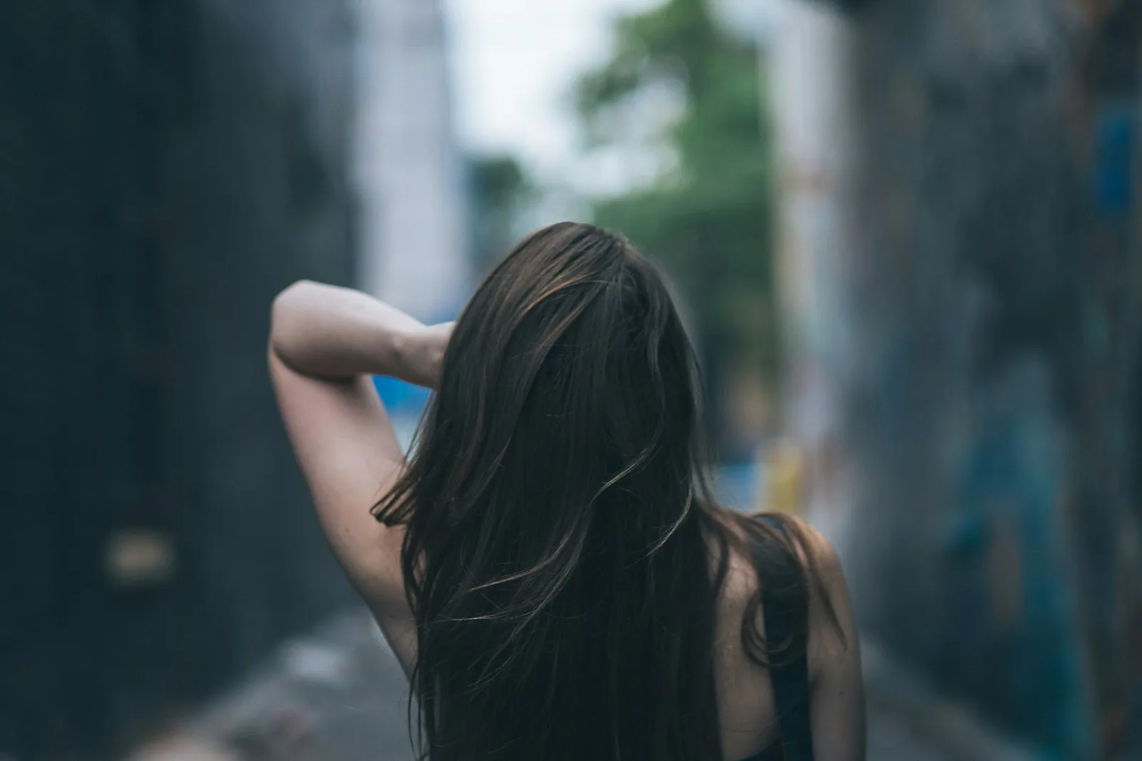 Lived-in espresso brunette from behind, lifted just enough at the face.